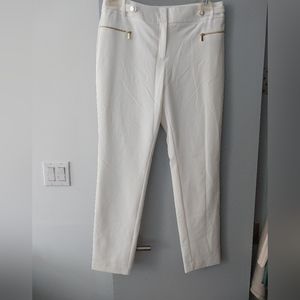 White pants with gold accents